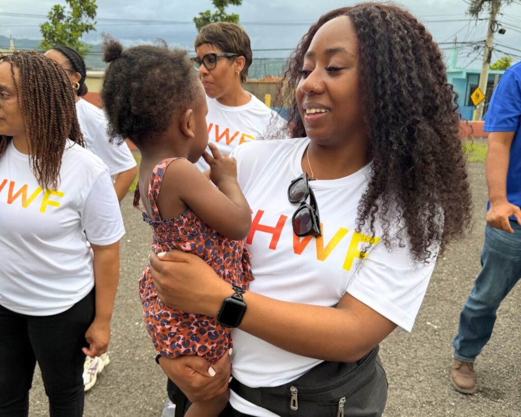 Volunteer with child in the Roehampton mission.
